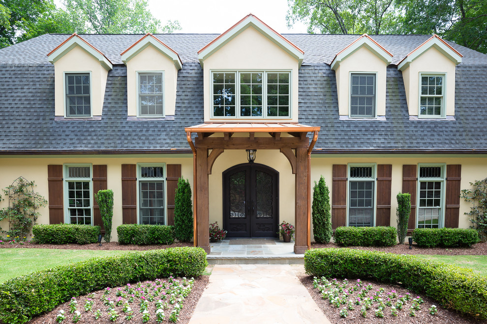 Design ideas for a beige classic two floor house exterior in Atlanta.