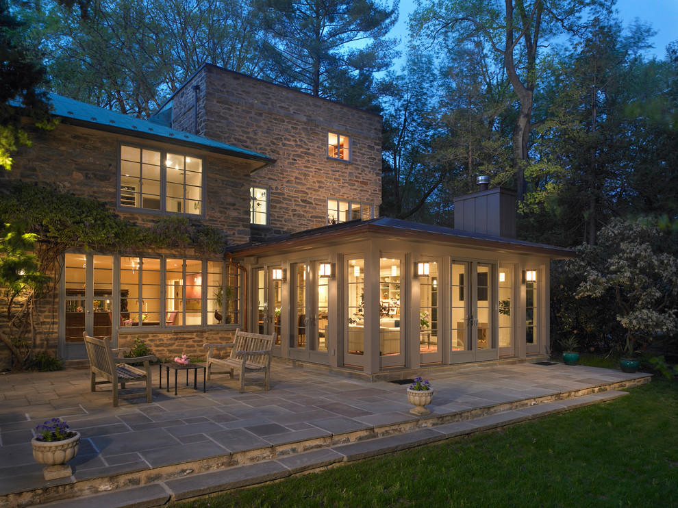 Example of a mid-sized classic gray stone exterior home design in Philadelphia