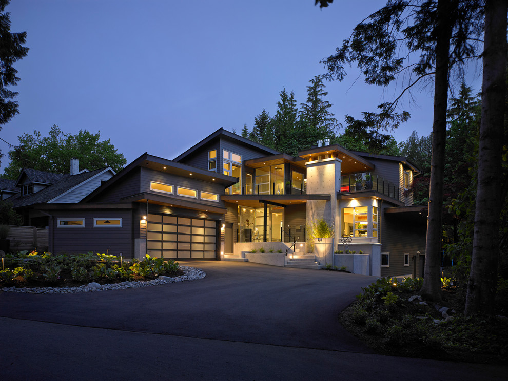 Inspiration for a large modern gray three-story concrete fiberboard exterior home remodel in Vancouver