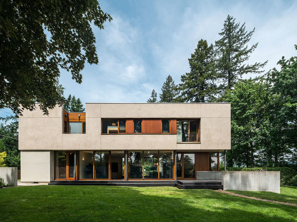 Idee per la villa beige contemporanea a due piani con tetto piano e rivestimenti misti
