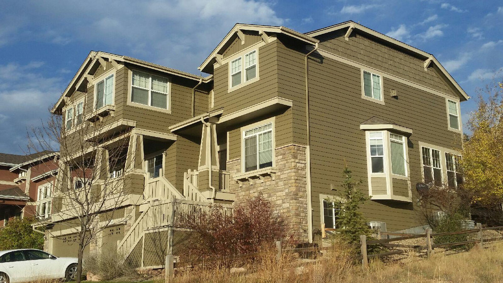 This is an example of a brown traditional house exterior in Denver.