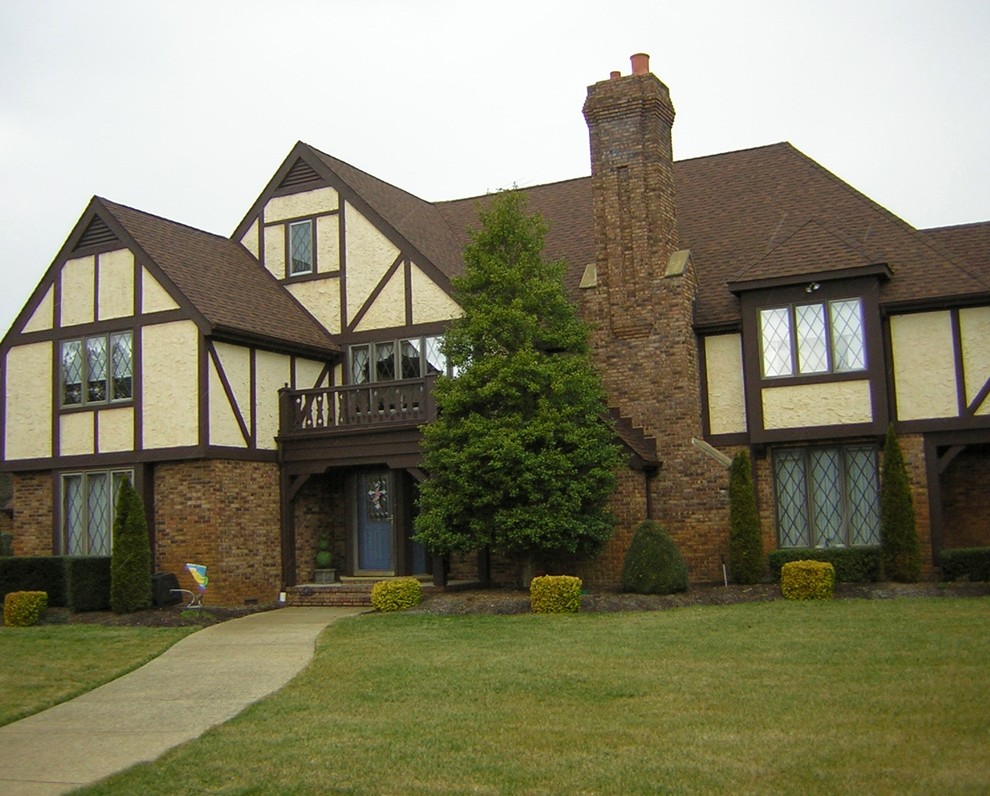 Exterior Painting Yellow Tudor House in Linwood, NJ Exterior Painting Yellow Tudor House in Linwood, NJ
