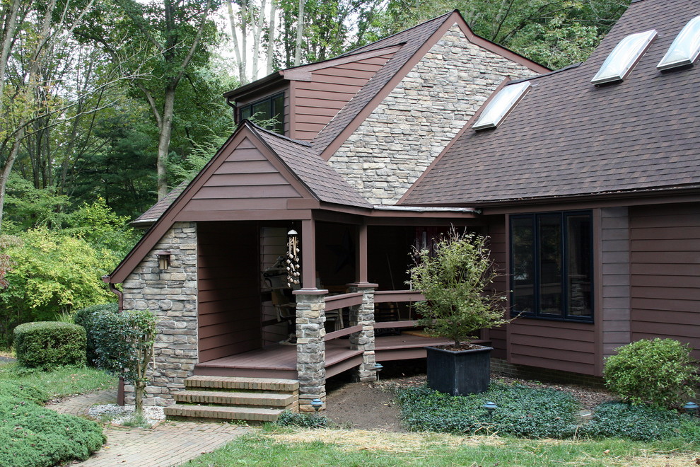 Example of a mid-sized classic brown two-story wood exterior home design in Philadelphia with a shingle roof