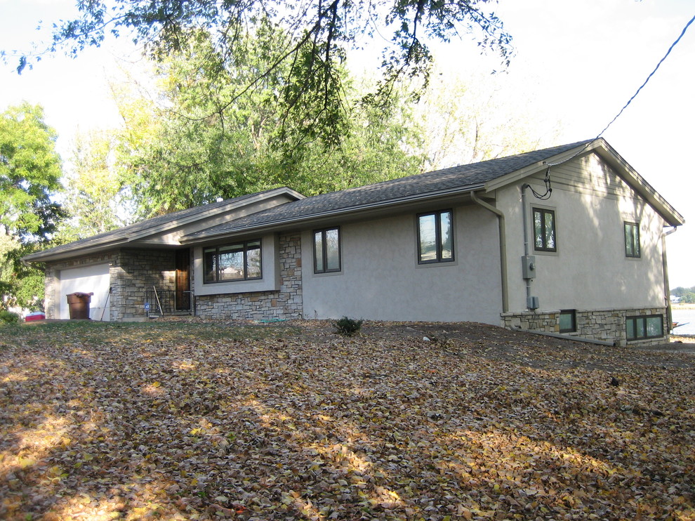 Exterior renovation of this Maplewood, MN, stucco home Traditional