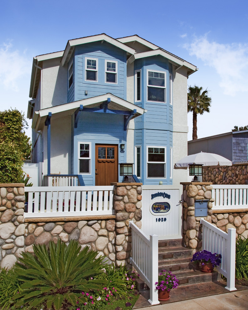 Photo of a victorian house exterior in San Diego with wood cladding.