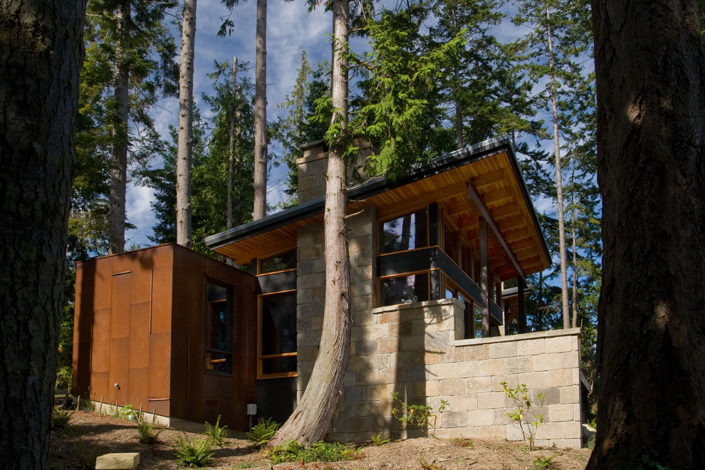Example of a mid-sized trendy gray one-story stone exterior home design in Seattle