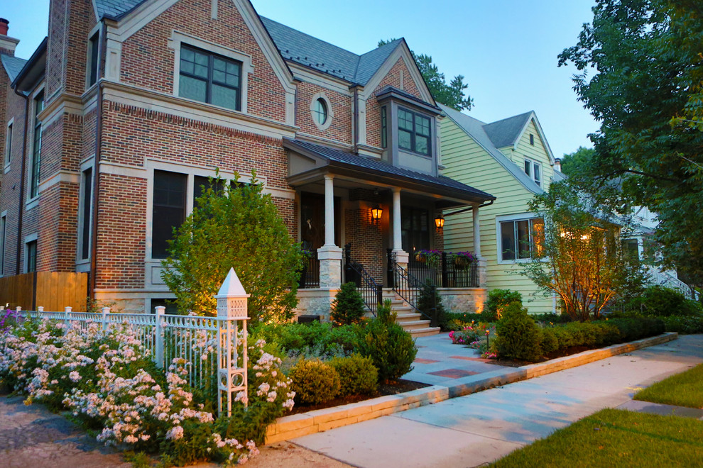 Photo of a large traditional two floor brick house exterior in Chicago.