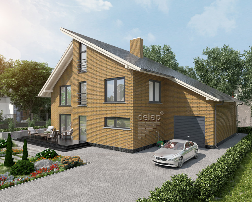 Esempio della facciata di una casa piccola gialla moderna con rivestimento in mattoni