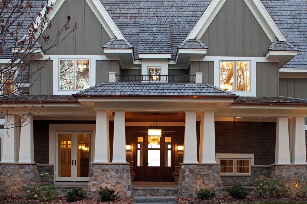 Example of an arts and crafts wood exterior home design in Minneapolis