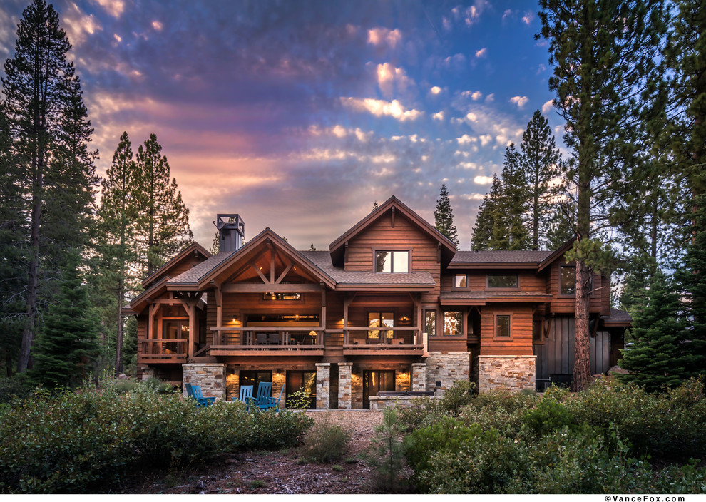 Inspiration for a huge rustic brown three-story wood exterior home remodel in Sacramento with a shingle roof