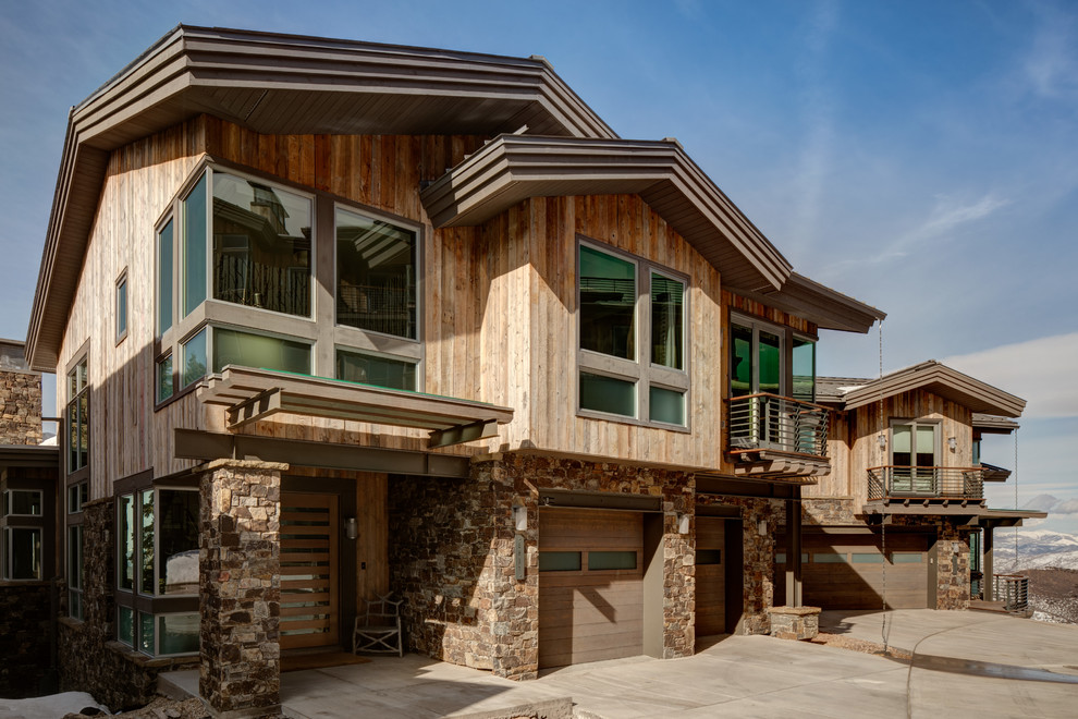 Large and brown rustic two floor detached house in Salt Lake City with a pitched roof and mixed cladding.