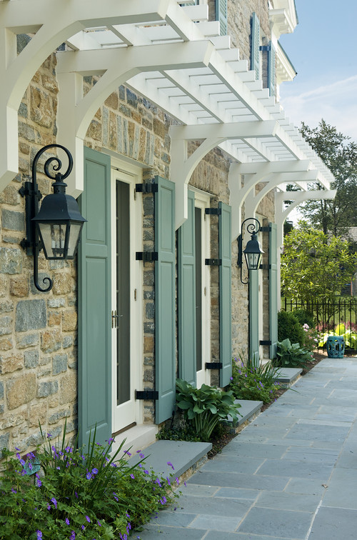 Shutters are a great way to add color and style to your house. They can be used on windows and doors, as well as other parts of the exterior like columns or fences. Shutters can be made from a variety of materials, including wood or metal. You could paint or stain them to get the look you want!