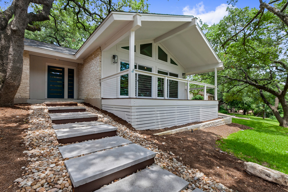 Inspiration for a large transitional white one-story mixed siding exterior home remodel in Austin with a shingle roof