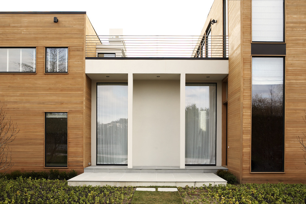 Modelo de fachada minimalista con revestimiento de madera