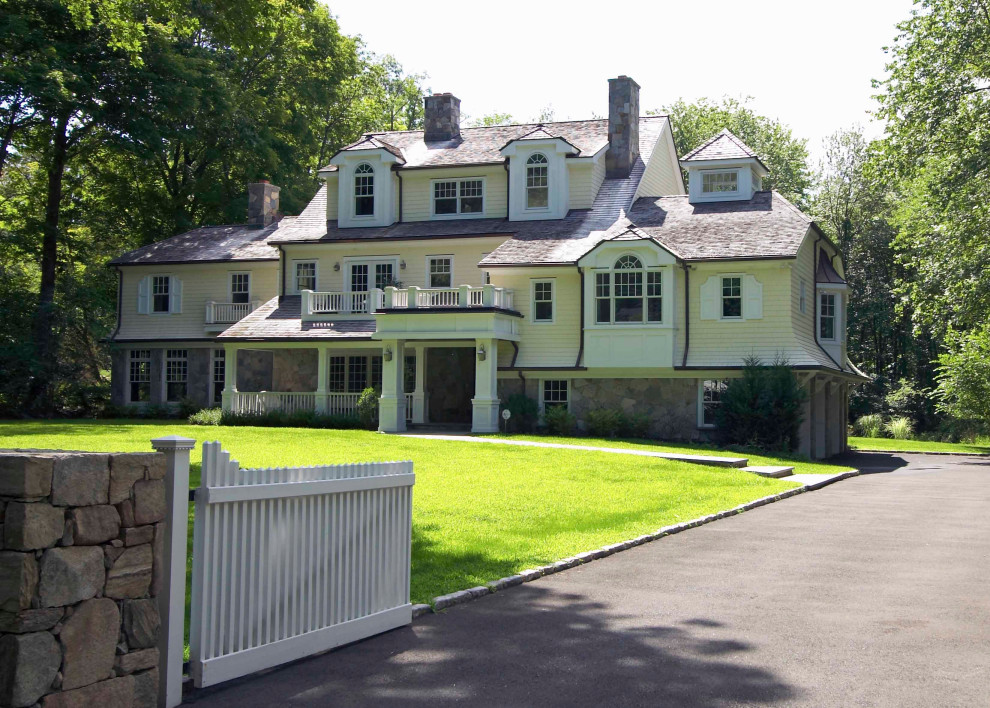 Example of a large ornate white three-story wood house exterior design in New York with a hip roof and a shingle roof