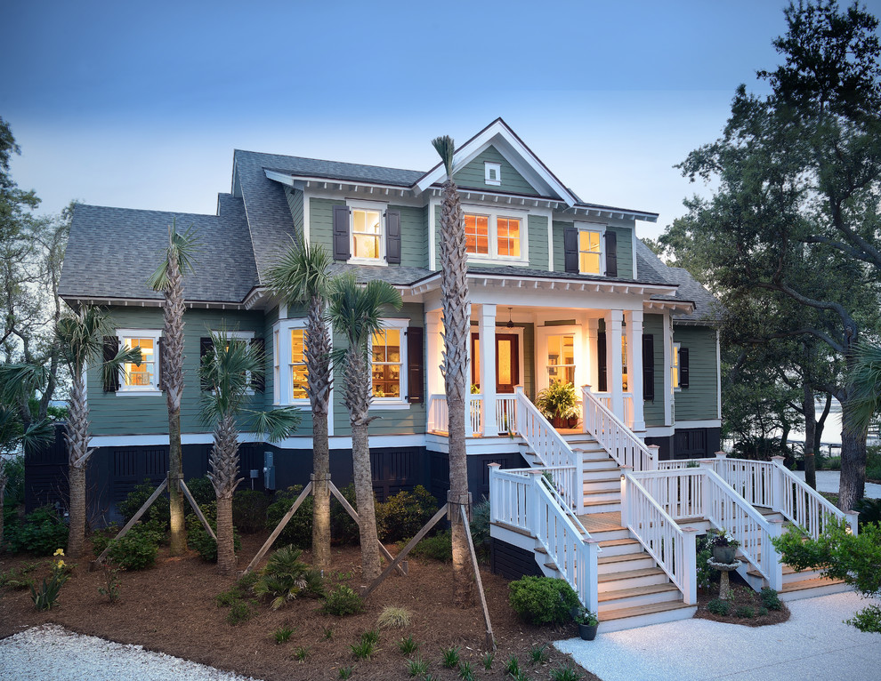 Photo of a green traditional two floor house exterior in Charleston.