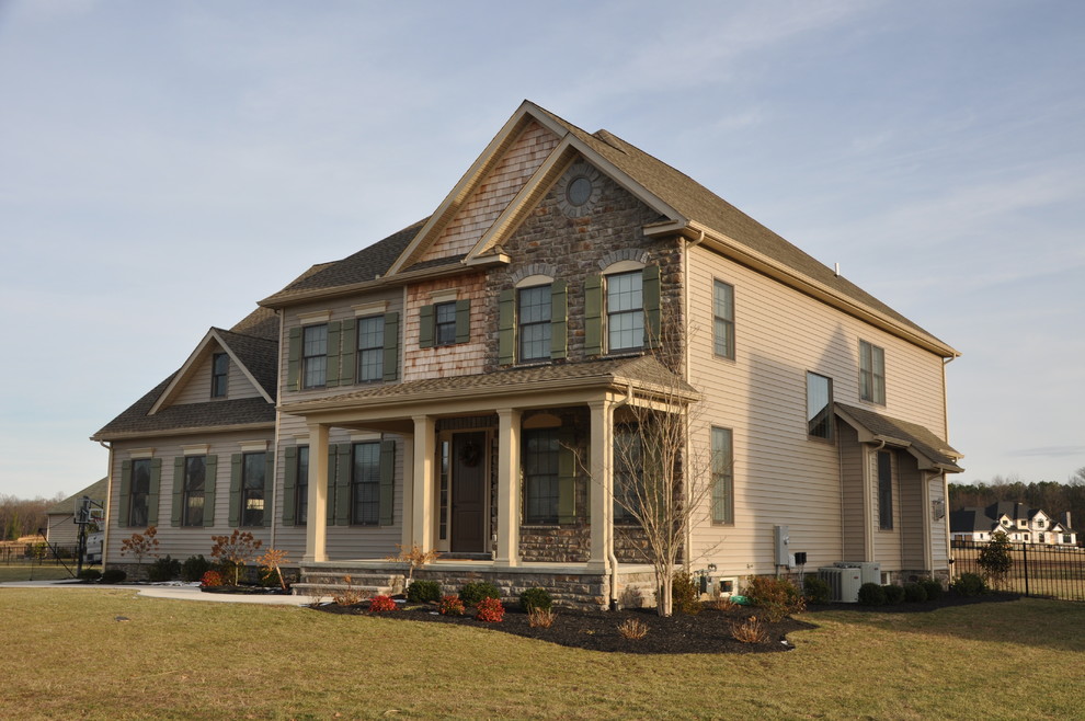 Inspiration for a mid-sized timeless beige split-level concrete fiberboard exterior home remodel in Philadelphia