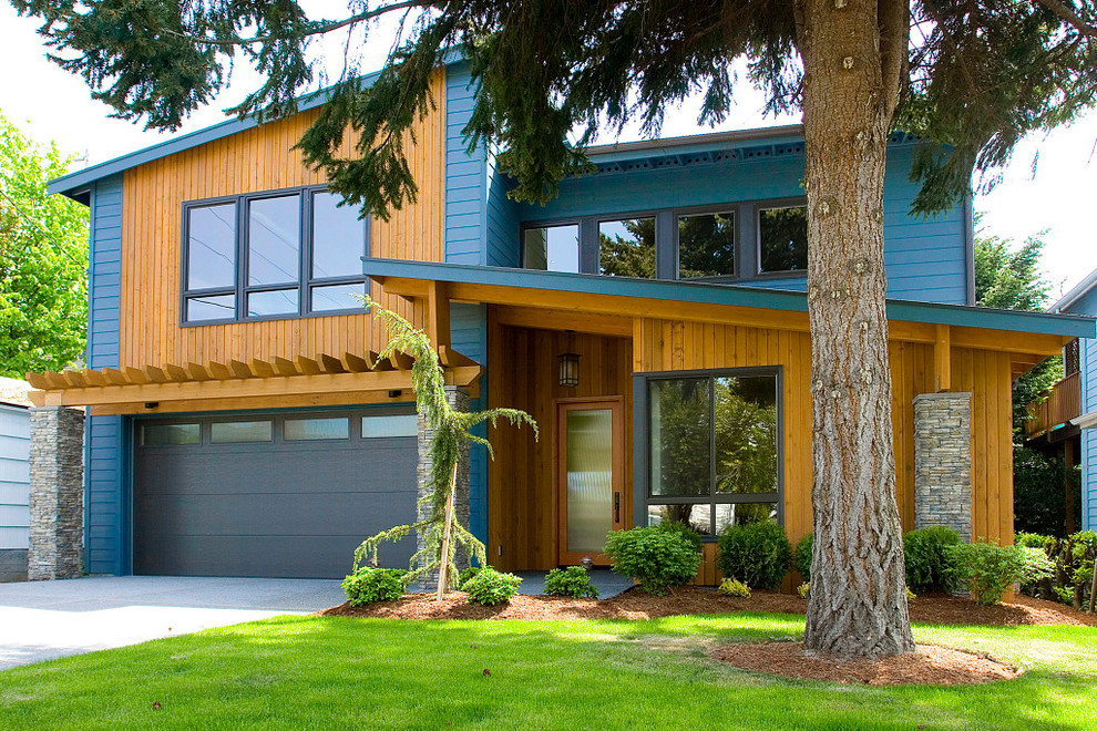 Mid-sized trendy blue two-story mixed siding exterior home photo in Seattle