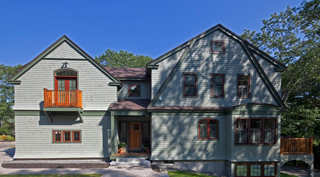Inspiration for a medium sized and green classic two floor house exterior in Portland Maine with wood cladding.
