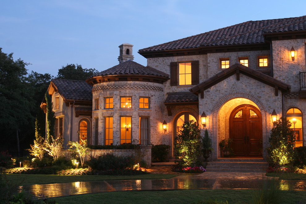 Example of a tuscan two-story exterior home design in Dallas