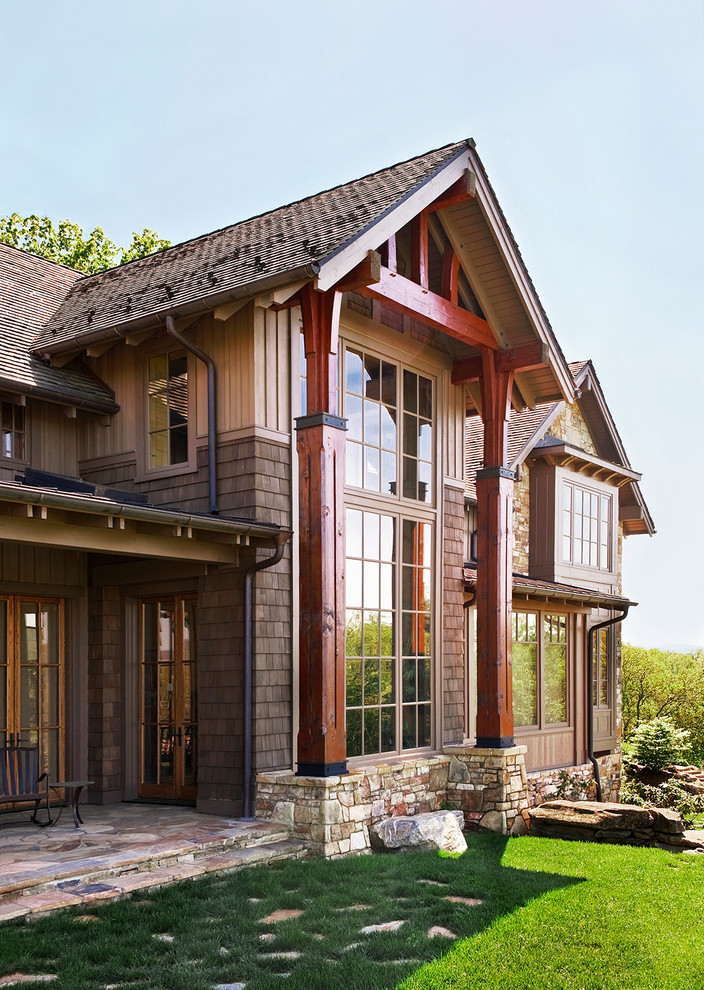 Example of a mountain style wood exterior home design in Chicago