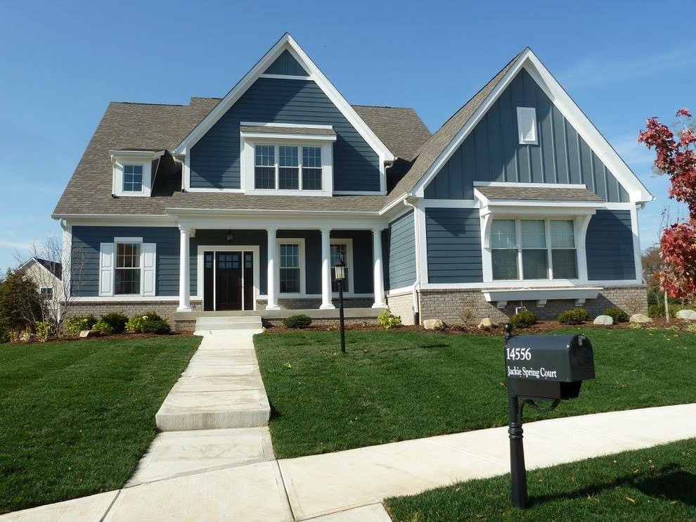 Photo of a blue and large traditional two floor detached house in Indianapolis with mixed cladding, a pitched roof and a shingle roof.
