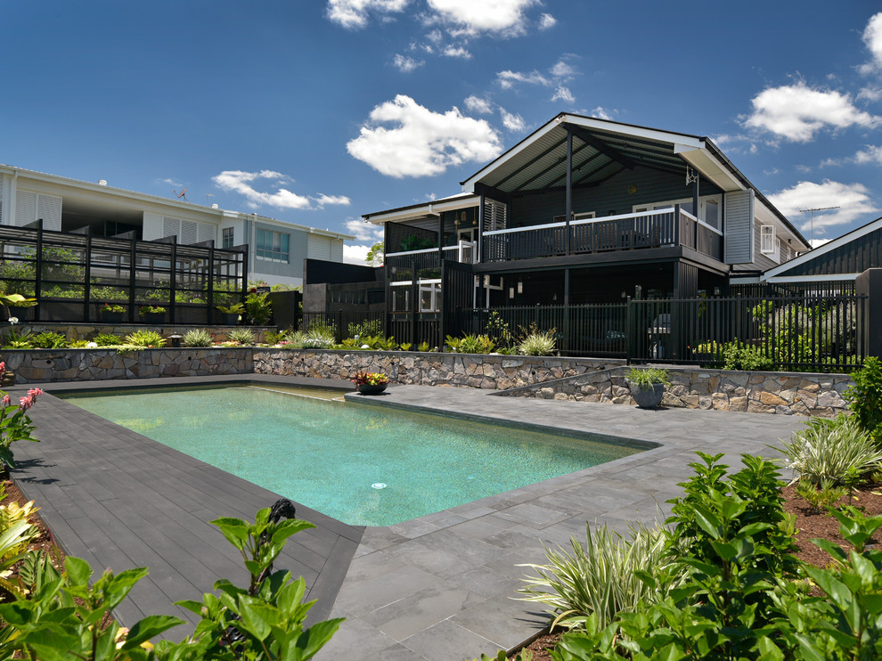 Large transitional black two-story exterior home photo in Brisbane with a metal roof