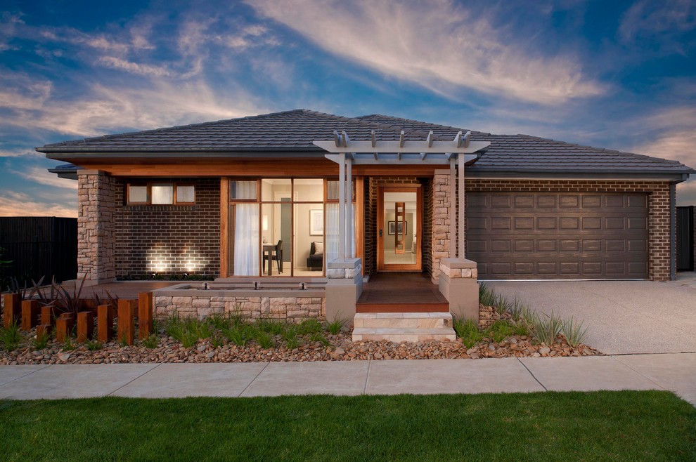 Design ideas for a contemporary brick house exterior in Melbourne.