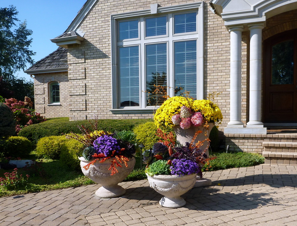 Inspiration for a small and beige rustic bungalow brick house exterior in Chicago.