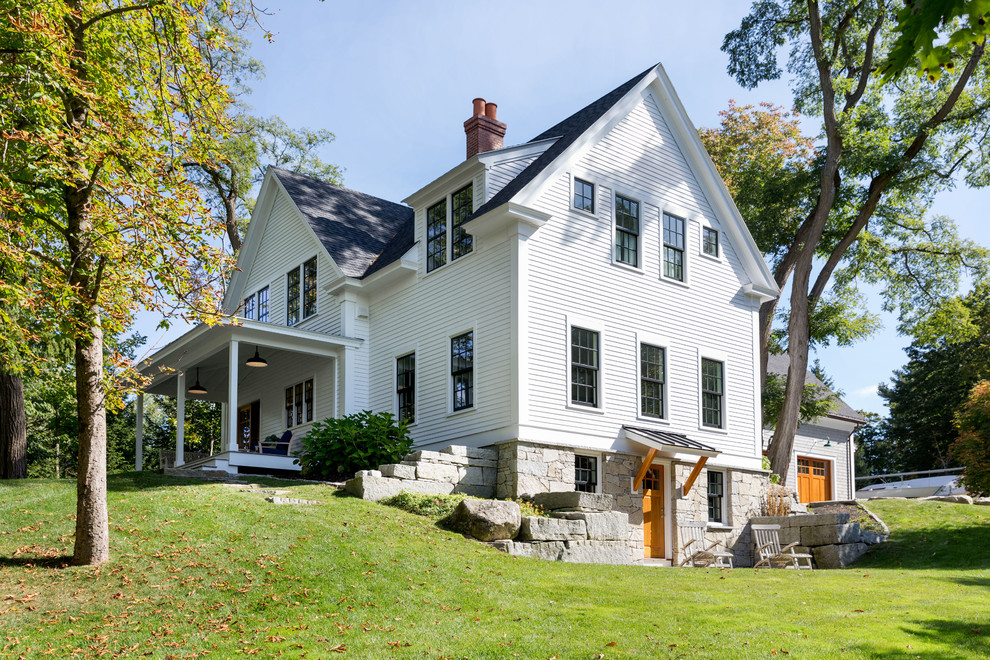 Large cottage white two-story wood exterior home idea in Portland Maine with a shingle roof