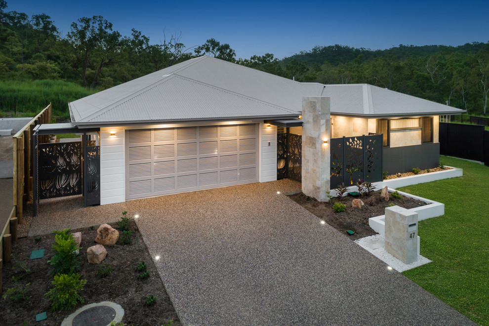 Inspiration for a large and beige modern bungalow detached house in Townsville with a hip roof and a metal roof.