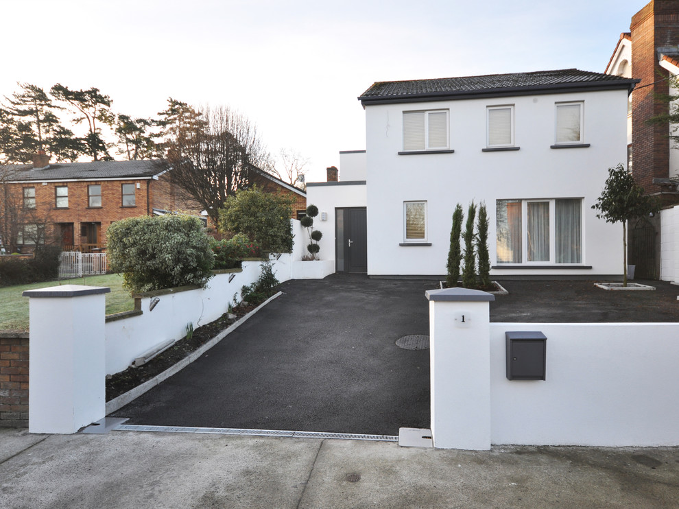 Inspiration for a white contemporary two floor house exterior in Dublin.