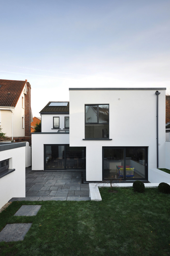 Design ideas for a white contemporary two floor house exterior in Dublin.
