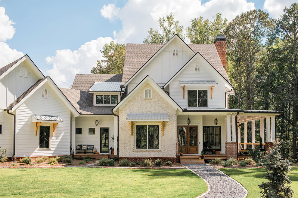 Example of a large farmhouse white two-story mixed siding exterior home design in Atlanta with a mixed material roof