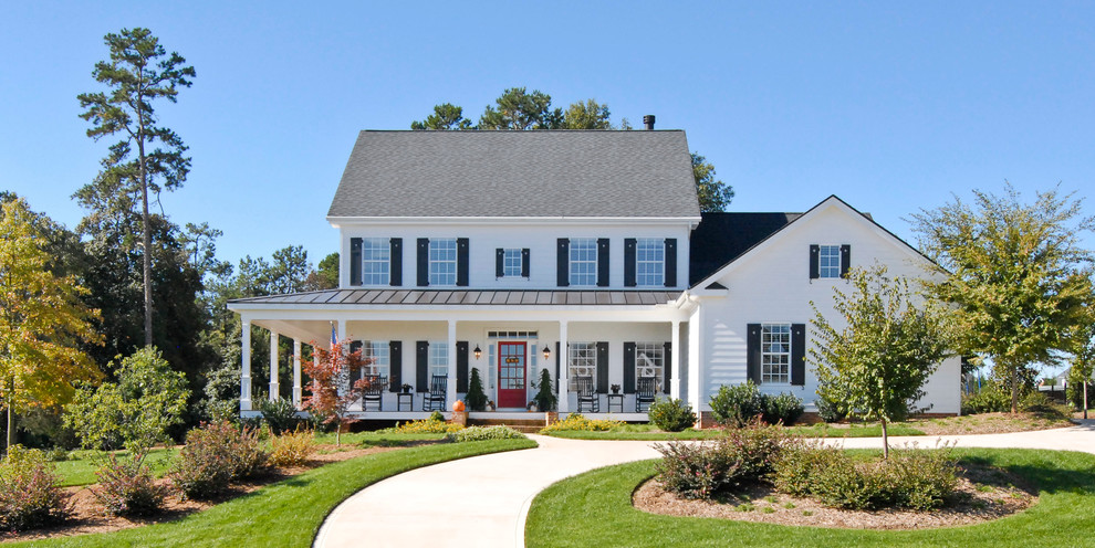 Farmhouse white two-story exterior home idea in Charleston with a mixed material roof