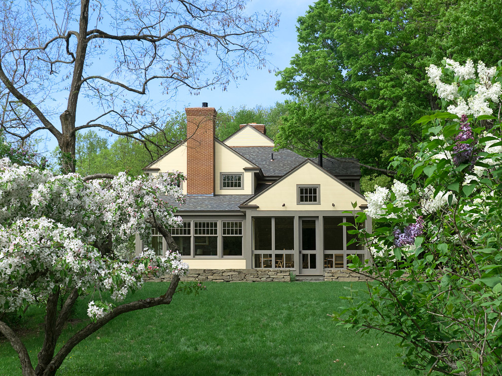 Inspiration for a farmhouse two-story wood gable roof remodel in Burlington