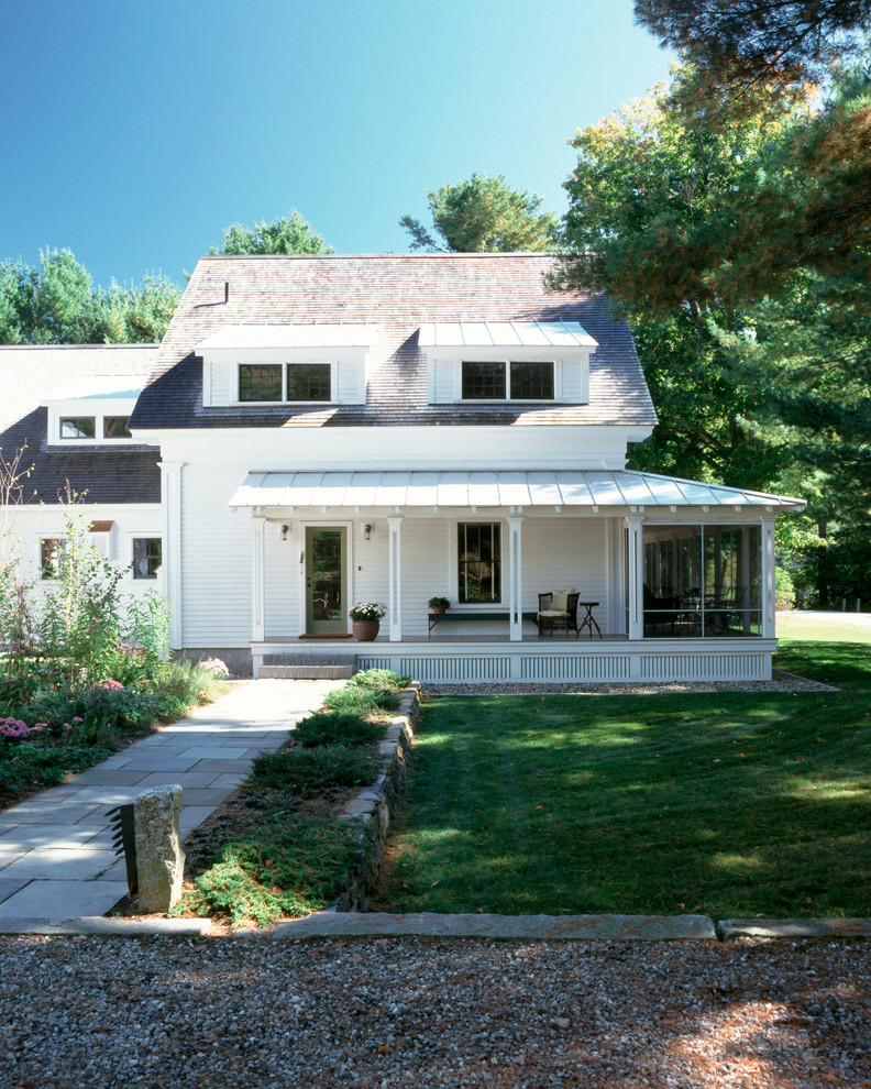 Example of a mid-sized country white two-story exterior home design in Other with a metal roof