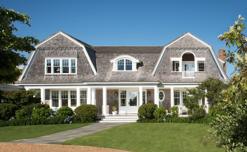 Inspiration for a coastal two-story wood exterior home remodel in DC Metro with a gambrel roof