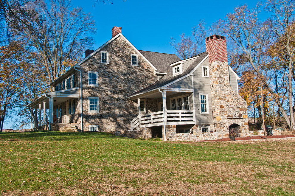 Design ideas for a medium sized farmhouse two floor house exterior in Philadelphia with stone cladding.