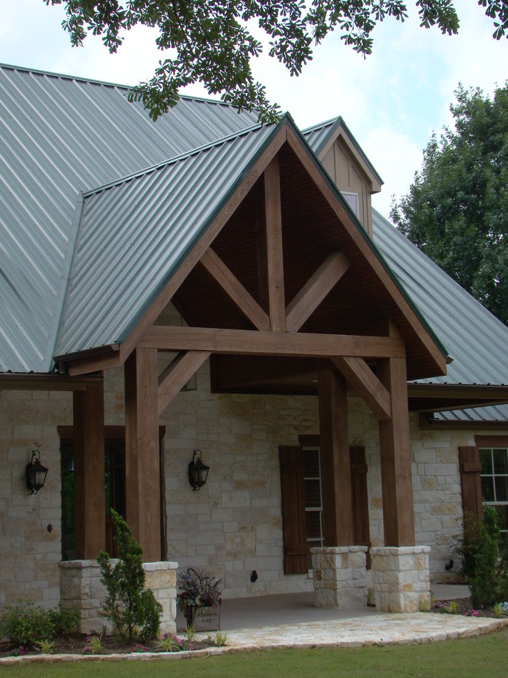 Inspiration for a cottage one-story stone exterior home remodel in Austin