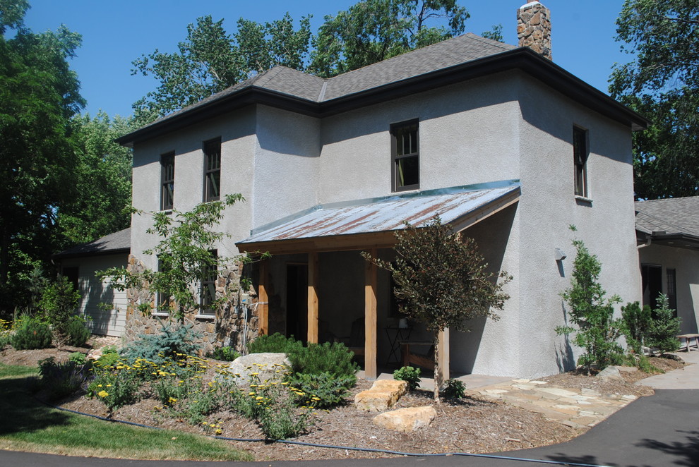 Example of a farmhouse exterior home design in Minneapolis