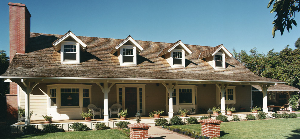 This is an example of a traditional house exterior in Santa Barbara with wood cladding.