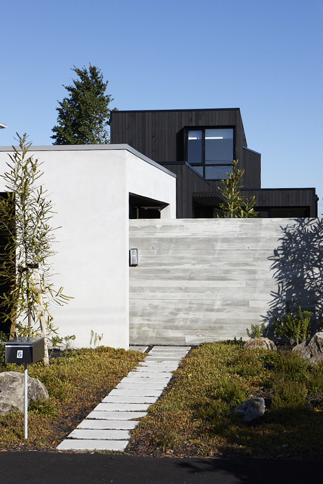 Example of a trendy exterior home design in Auckland