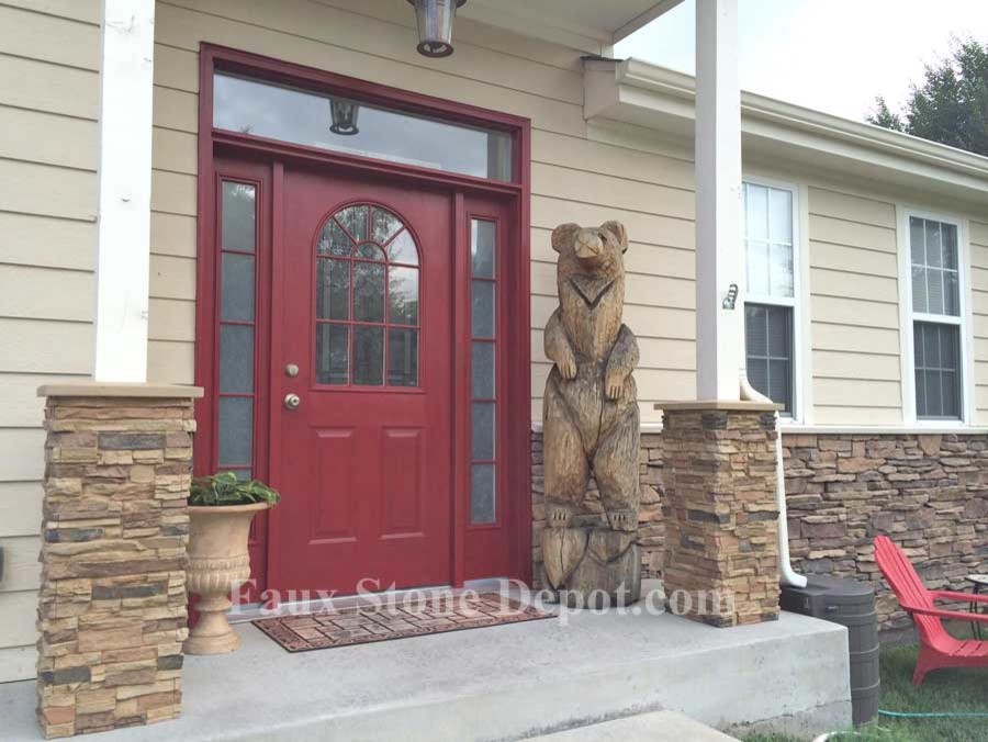 Medium sized contemporary bungalow house exterior in Denver with stone cladding.