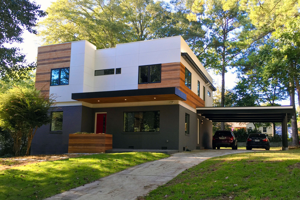 Design ideas for a medium sized and white modern two floor house exterior in Atlanta with concrete fibreboard cladding.