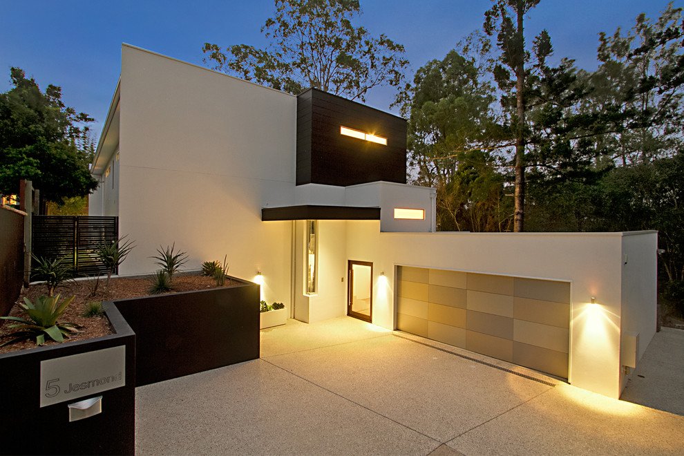 Diseño de fachada blanca minimalista extra grande de dos plantas con revestimiento de hormigón y tejado plano