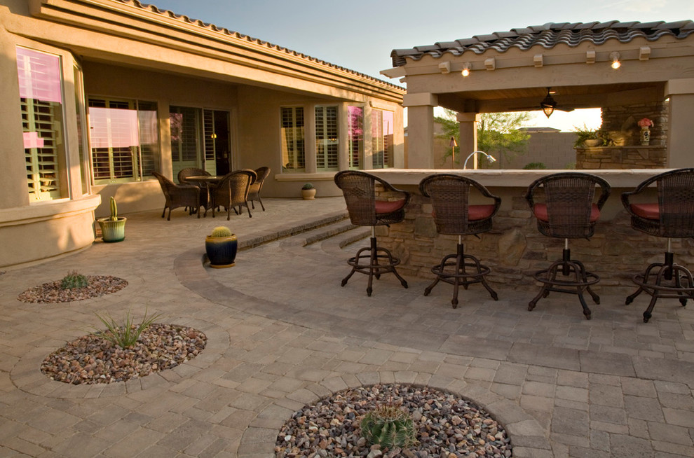 Design ideas for a large classic patio in Phoenix.