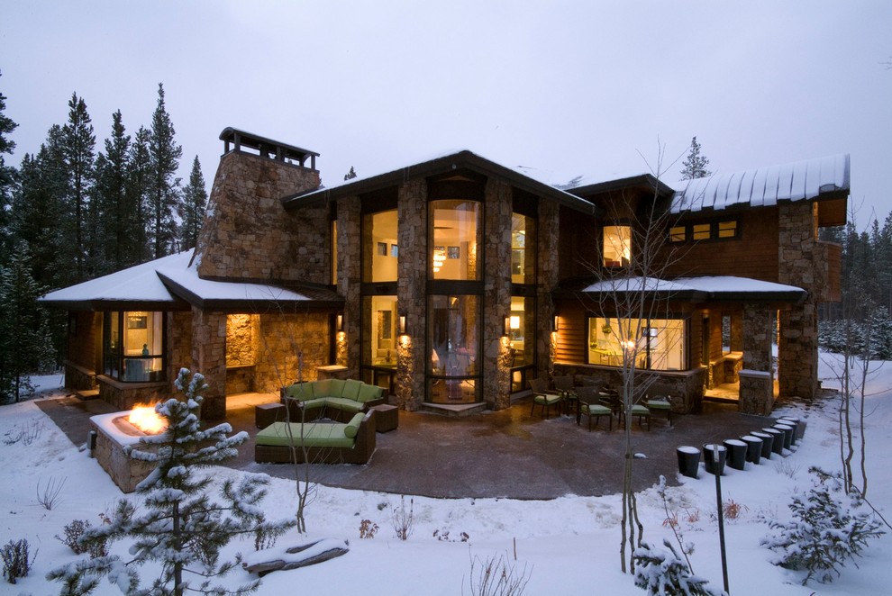Example of a large trendy brown two-story stone exterior home design in Denver