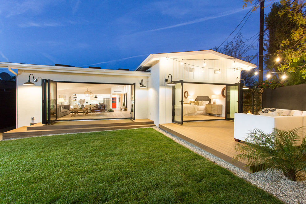 Example of a mid-sized country white one-story concrete fiberboard house exterior design in Los Angeles with a hip roof and a shingle roof
