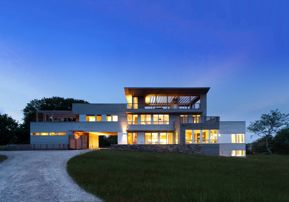 Idee per la facciata di una casa grande beige contemporanea a tre piani con rivestimento in legno e tetto piano